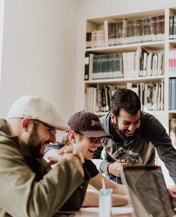 Three men laughing