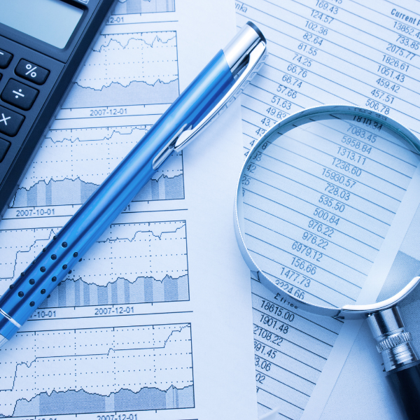 Graphs with calculator, pen, and magnifying glass